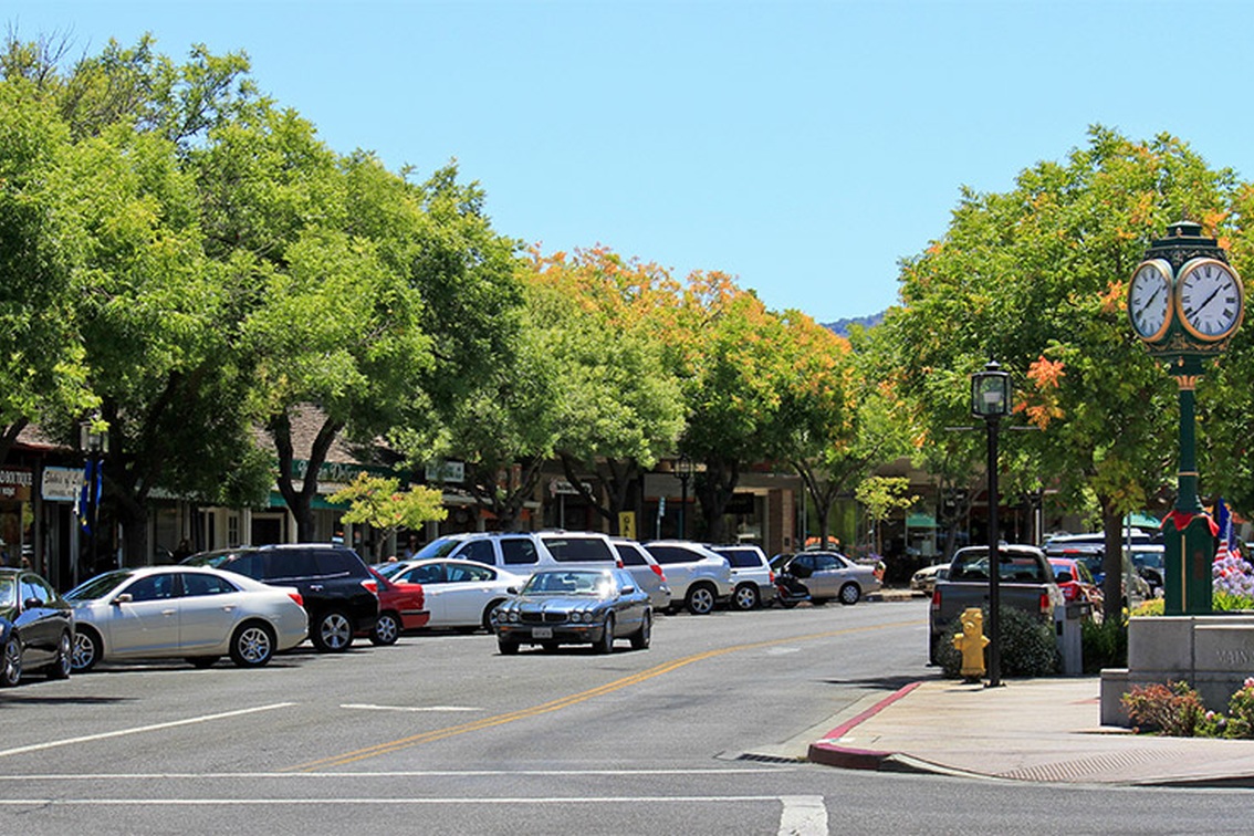 Tree-lined downtown Los Altos with shops and the Main Street clock